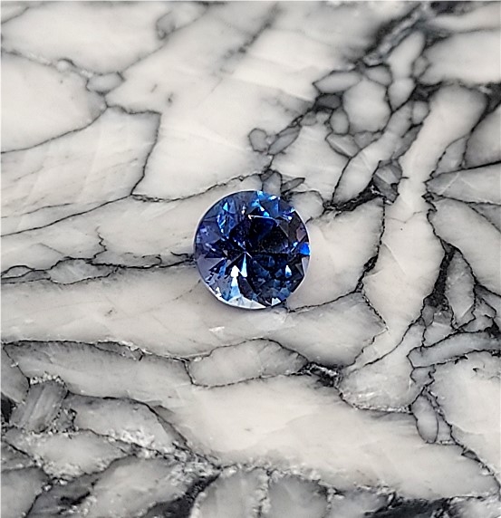 Faceted Benitoite, Round Cut, .66 cts., 5.1 mm, VVS